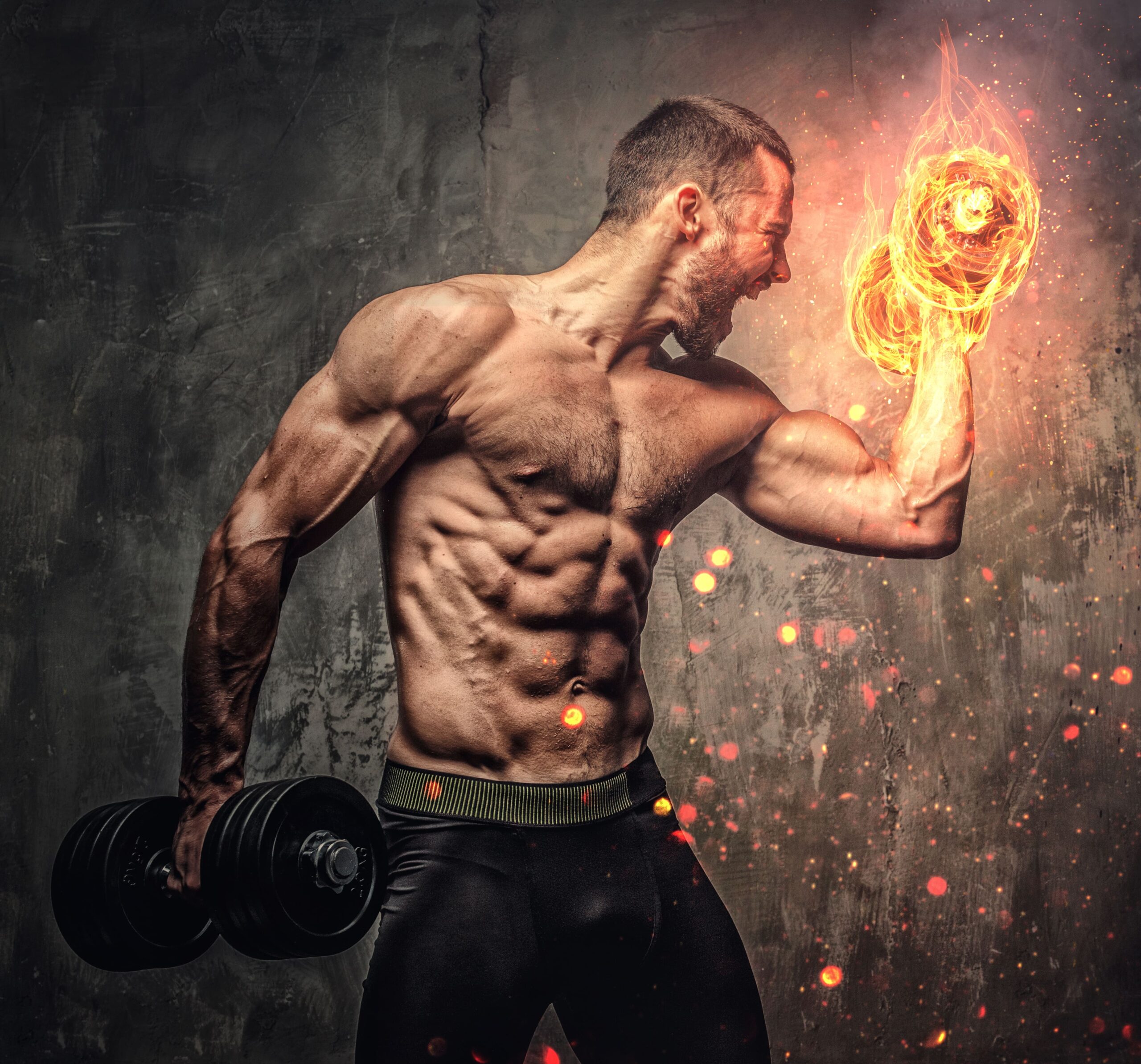 artistic-portrait-shirtless-muscular-male-with-burning-dumbbell-min